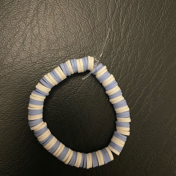 Purple and white clay bead bracelet